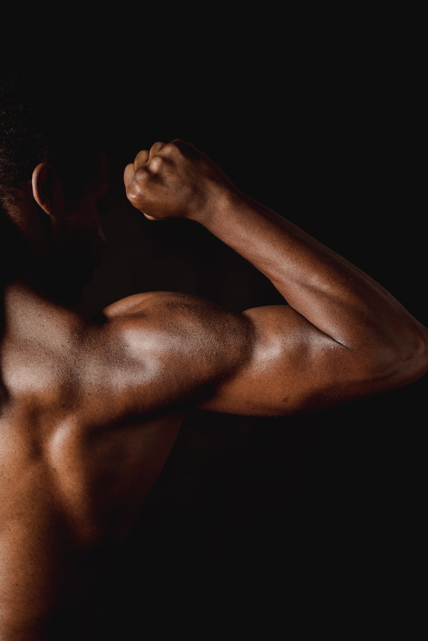 man flexing his muscles